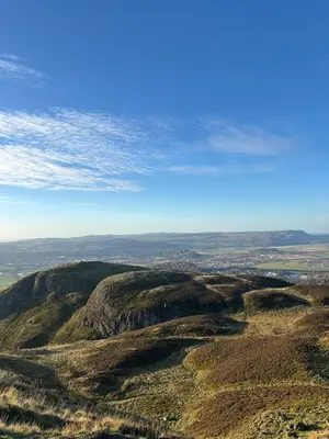 an aerial view of a mountain with a blue sky at Ivy Cottage in Causewayhead