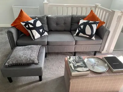 a living room with a couch and a coffee table at Coorie Cottage in Edinburgh