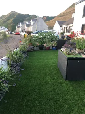 a yard filled with lots of plants and flowers at Seaview Cottage Bellochantuy