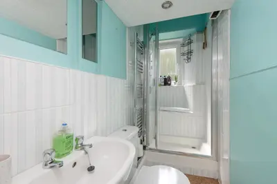 a bathroom with a sink and a toilet and a shower at Andy's Pad in Edinburgh