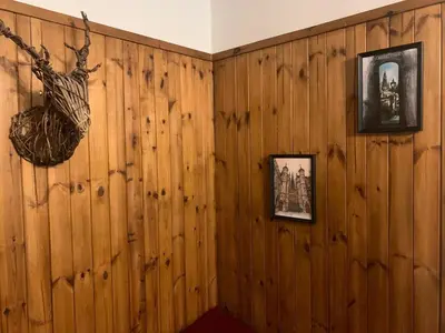 a room with wood paneling and pictures on the wall at Andy's Pad in Edinburgh