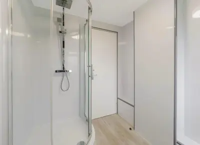 a shower with a glass door in a bathroom at Free Parking - 3 Bedrooms - Sleeps 7 - Airport in Paisley