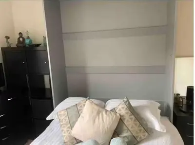 a bedroom with a bed with white sheets and pillows at City Centre Double Room in Glasgow