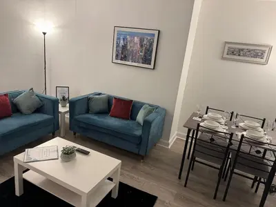 a living room with a couch and a table at Stylish 2BR in Renfrew in Renfrew
