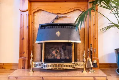 a fireplace with a pirate hat on top of it at Bright, spacious house in Edinburgh