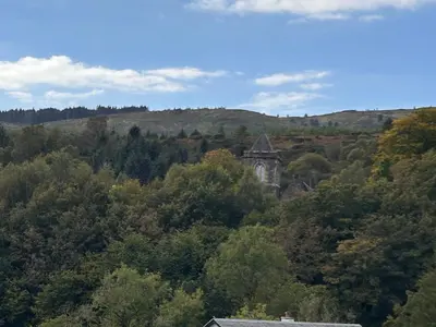 an old building in the middle of a forest at Carmona Bank in Dunoon