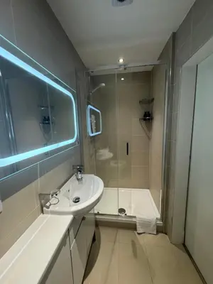 a bathroom with a sink and a shower at West Coates Mansion in Edinburgh