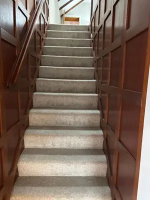 a flight of stairs in a building at Craigievar Cottage Skelmorlie in Skelmorlie