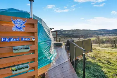 a wooden walkway with a sign on a wooden fence at 1 Bed in Denny oc-h33665 in Denny