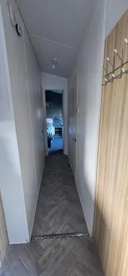 a hallway leading to a room with at Terri Towers in Stevenston