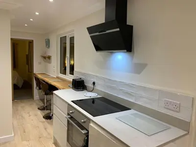 a kitchen with a sink and a counter top at Salen Pier Haven in Salen
