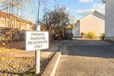 a parking sign on the side of a street at The Riverside Rest 2 in Stirling