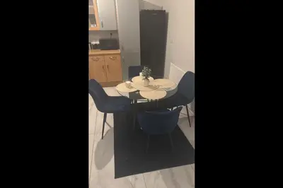 a kitchen with a table and chairs in a room at 23 Ash road in Moffat