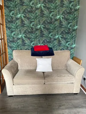 a red and blue blanket sitting on top of a couch at Room with a view in Irvine