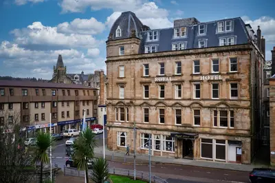 an old building on the corner of a street at The Oban Apartment in Oban