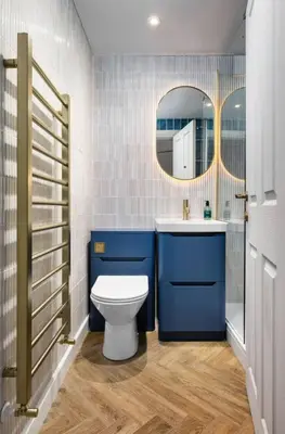 a bathroom with a toilet and a sink and a mirror at Modern 1-Bed Retreat by Stirling Train Station in Stirling