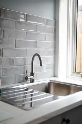 a stainless steel sink in a kitchen with a window at 2-Bedroom Flat South Ayrshire in Troon