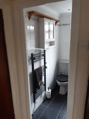 a small bathroom with a toilet and a sink at Carvetii - Jute House, ground floor, 2 bedroom flat in Rosyth