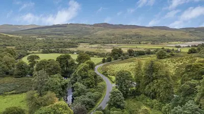 an aerial view of a road in the hills at Finest Retreats - Garden Cottage at Ormidale House in Clachan of Glendaruel
