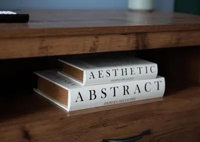 three books stacked on top of each other on a table at Vacant Nests Ivy Cottage 3BR Wi-Fi in Kilsyth