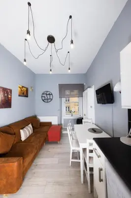 a living room with a couch and a table at Central Apartment by the Meadows 9 in Edinburgh