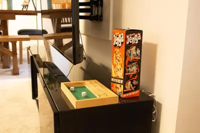 a table with two boxes on top of it at Littlebay Penthouse in Oban