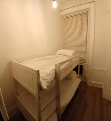 a white bunk bed in a room with a window at 89A Bank Street 3 bedroom in Jamestown