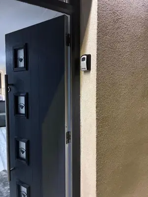 a door with a mirror on the side of a building at 96 Glasgow road in Newbridge