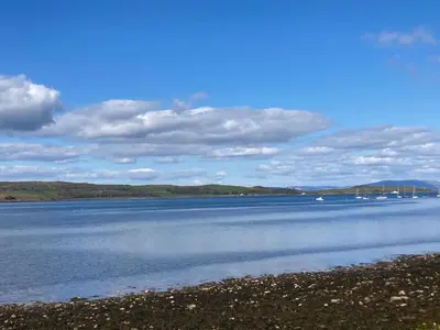 a large body of water with boats in it at The Bonnie Stay Garden Apartment in Largs