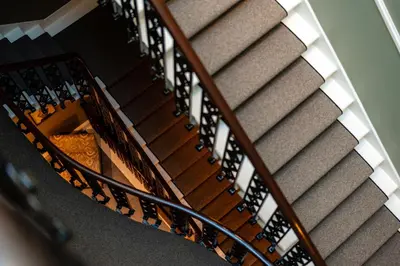 an overhead view of a staircase with wine bottles at Dragon Suites Luxury Apartments at Rutland Square in Edinburgh