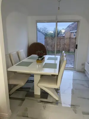 a white dining room table with chairs and a window at 4 Bed Detached Home Perfect for Families & Groups in Glasgow