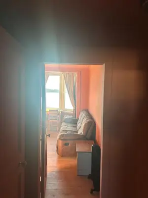 a living room with a couch and a window at The Skipper's Rest in Millport