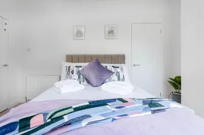 a bed with two pillows on top of it at Fraser Apartment- 2 Bedrooms Inverleith, Edinburgh in Edinburgh