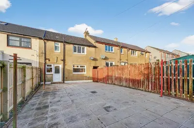 an empty parking lot in front of a house at The Hide - Suburban Terraced Home in Horse Isle