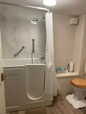 a bathroom with a shower and a toilet at Garden flat at Broomfield in Moffat
