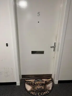a door with a dog bed in front of it at Room in shared flat in Edinburgh