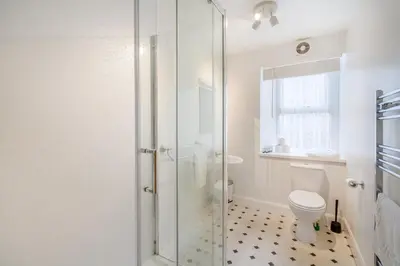 a bathroom with a toilet and a glass shower at 3 Bed in New Galloway oc-r34387 in New Galloway