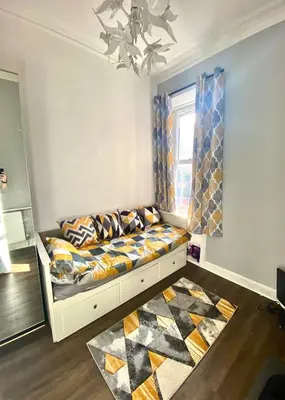 a bedroom with a bed and a window at Two-bedroom city retreat close to top sites in Edinburgh