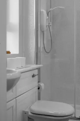 a bathroom with a shower with a toilet and a sink at Executive 3 Bedroom - Corporate And Contractor Stays in Glasgow