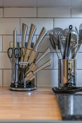 a bunch of knives and utensils on a counter at Executive 3 Bedroom - Corporate And Contractor Stays in Glasgow