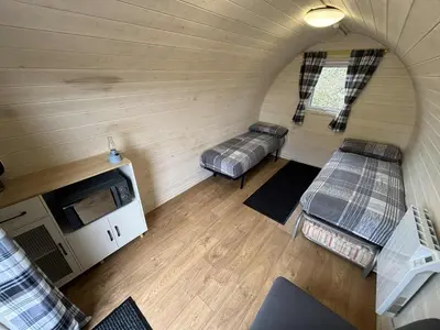 an overhead view of a room with two beds in a tiny house at Pentland View Campsite in Haywood