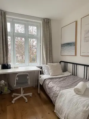 a bedroom with two beds and a desk and windows at Private Rooms Near Acton Main Line Direct Elizabeth Line to Heathrow in Moffat