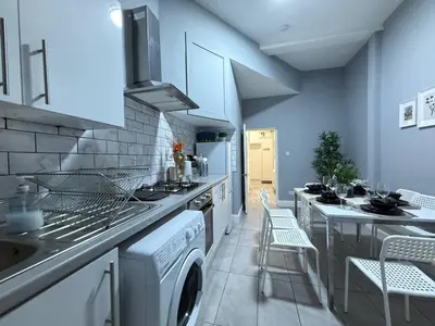 a kitchen with a washer and dryer at Glasgow centre New property in Glasgow