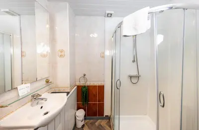 a bathroom with a sink and a shower at Charming and Spacious City Getaway 3 in Edinburgh
