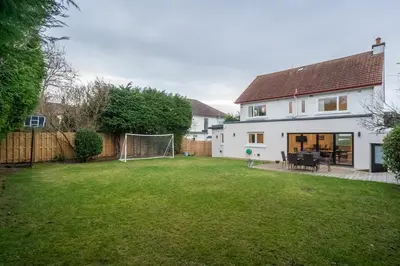 a house with a soccer field in the yard at Spacious 5-Bed Home with Garden Parking - Pass the Keys in Edinburgh