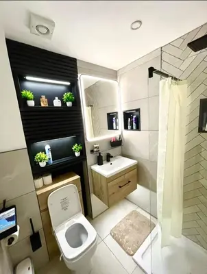 a small bathroom with a toilet and a sink at West-End 2 Bed Flat Entire Place w Free Parking in Glasgow