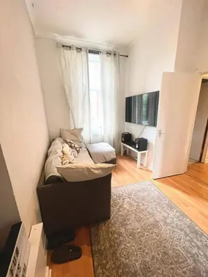 a small room with a bed and a tv at West-End 2 Bed Flat Entire Place w Free Parking in Glasgow