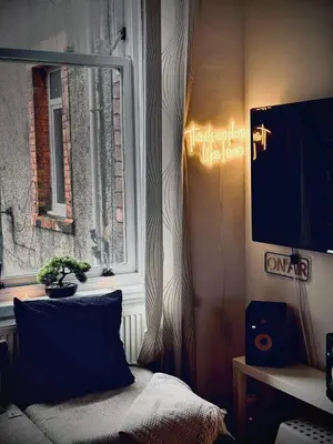 a bedroom with a window with a sign on the wall at West-End 2 Bed Flat Entire Place w Free Parking in Glasgow