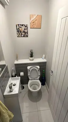a bathroom with a toilet and a sink at Ella's Place in Moffat