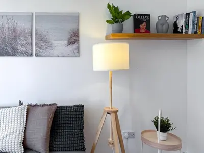 a living room with a lamp and a couch at Wonderfull stays new property near Glasgow 2 bedrooms in Dalmuir